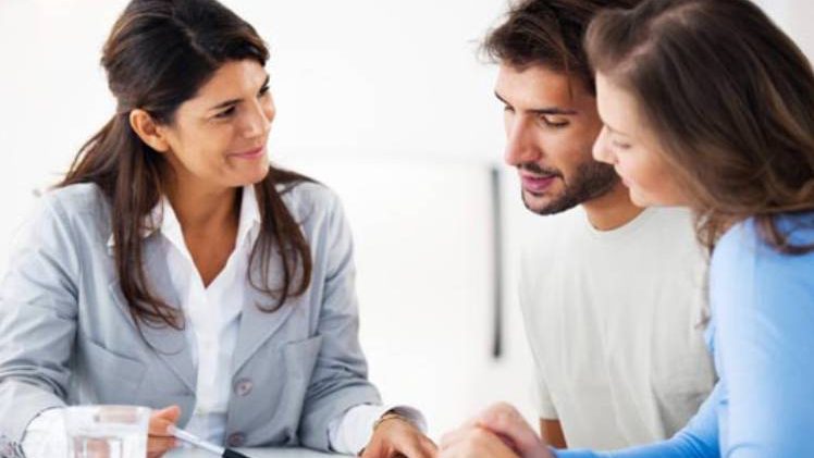 Representing A Bank Manager and Young Couple Discussing About Loan Documents.