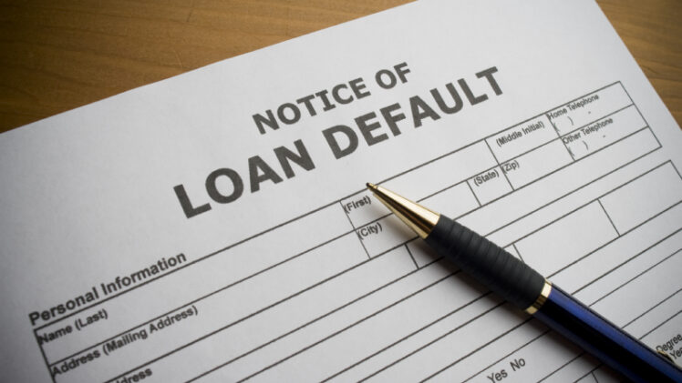 An Image Of A Notice of Loan Default Placed On The Table.